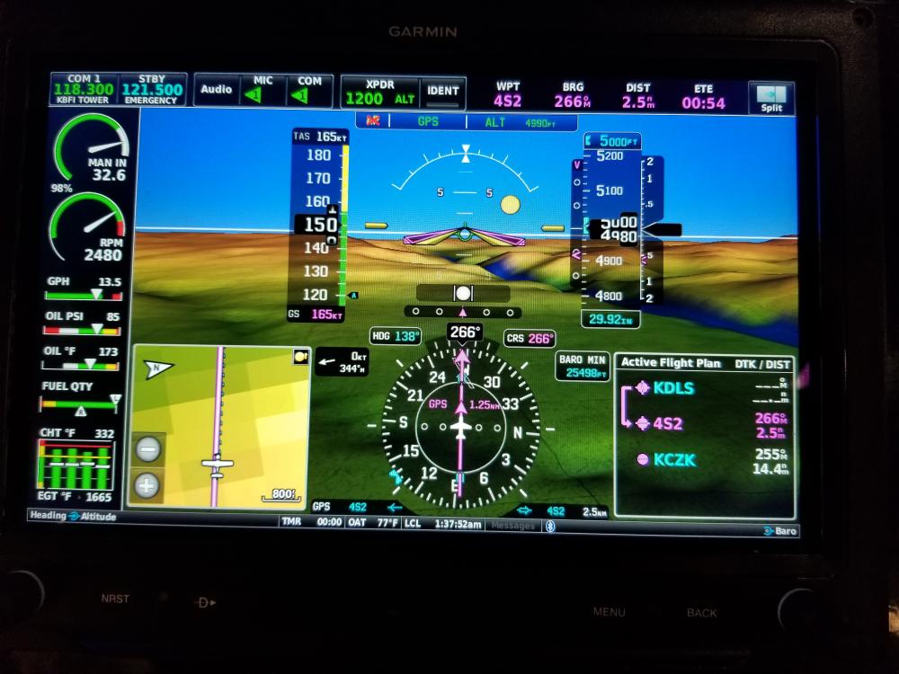 A computer screen showing an airplane flying over the ground.