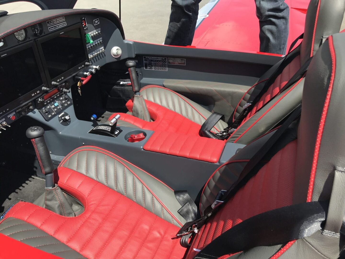 A red and black car with two seats in it