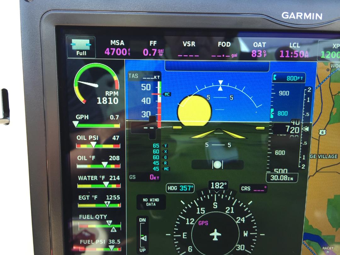 A close up of the instrument panel of an airplane