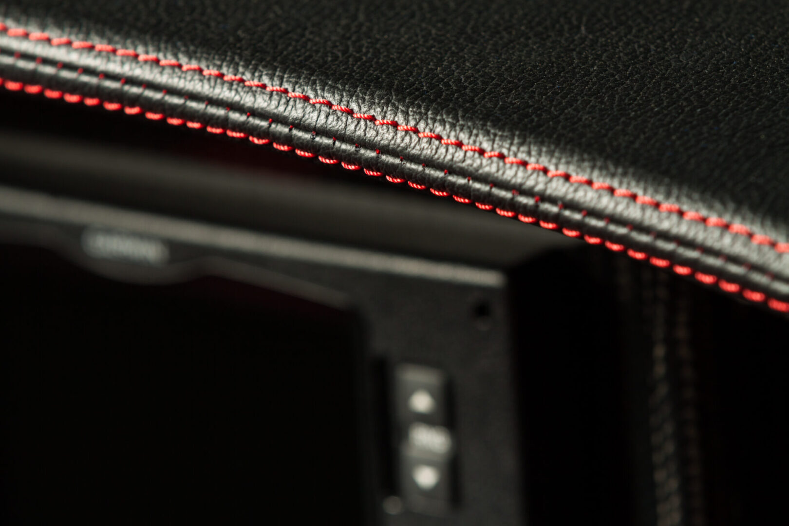 A close up of the stitching on a car seat