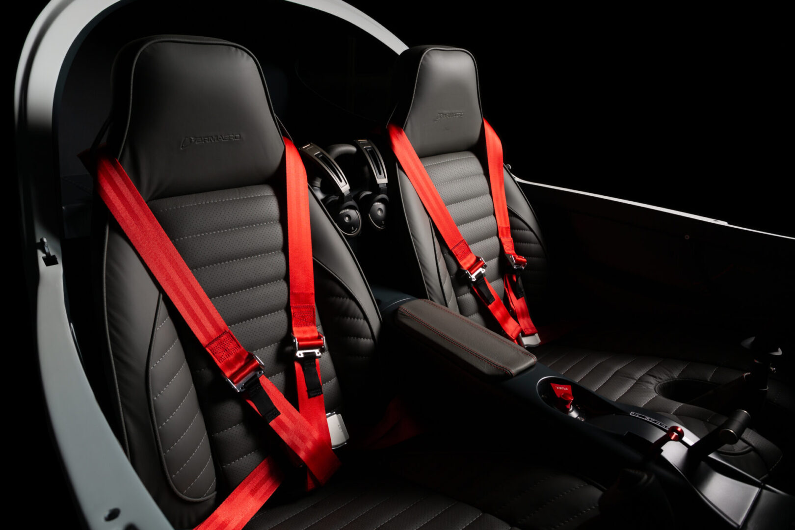 A car seat with two red seats and one black seat.
