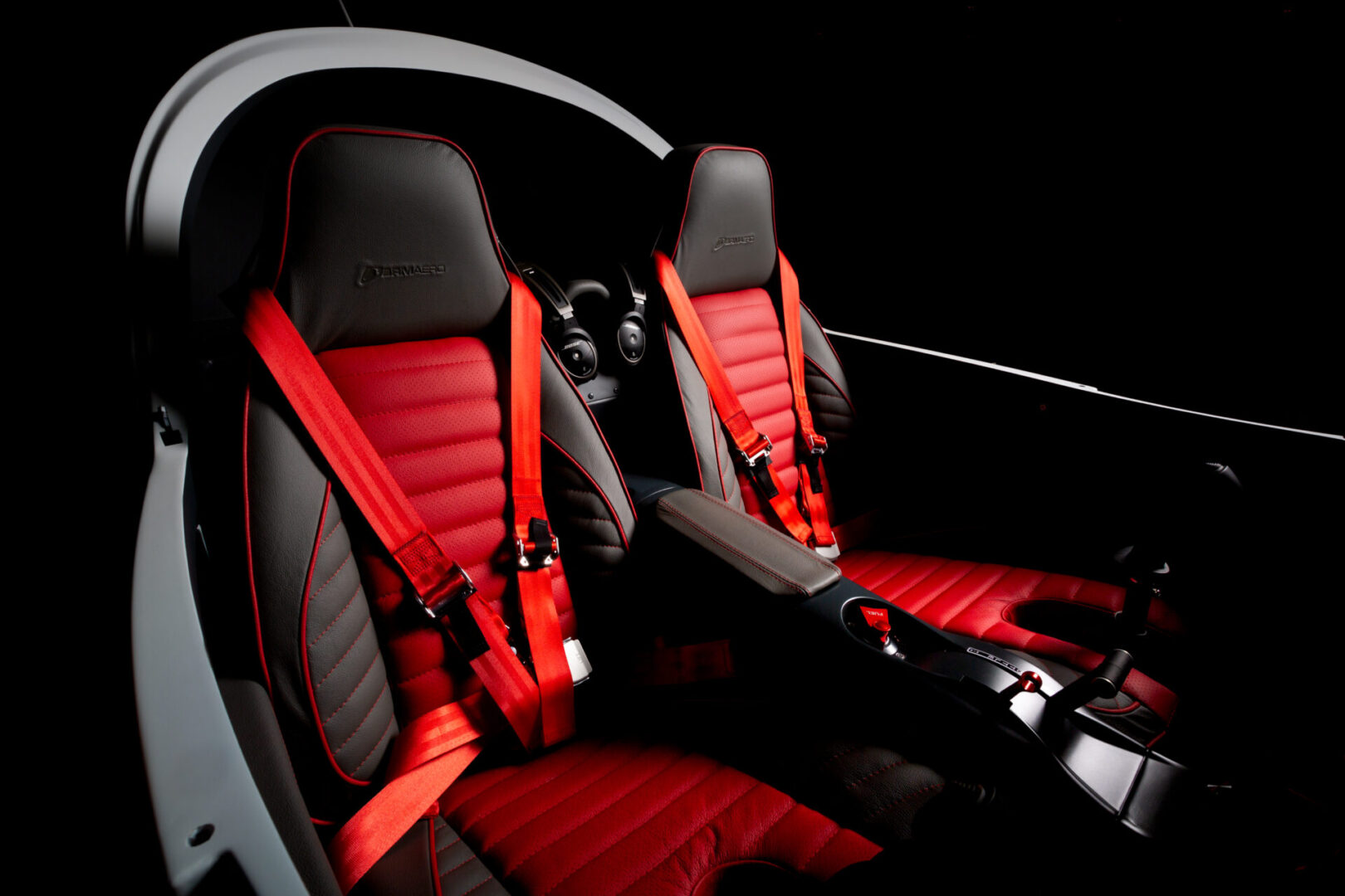 A car seat with red seats in it