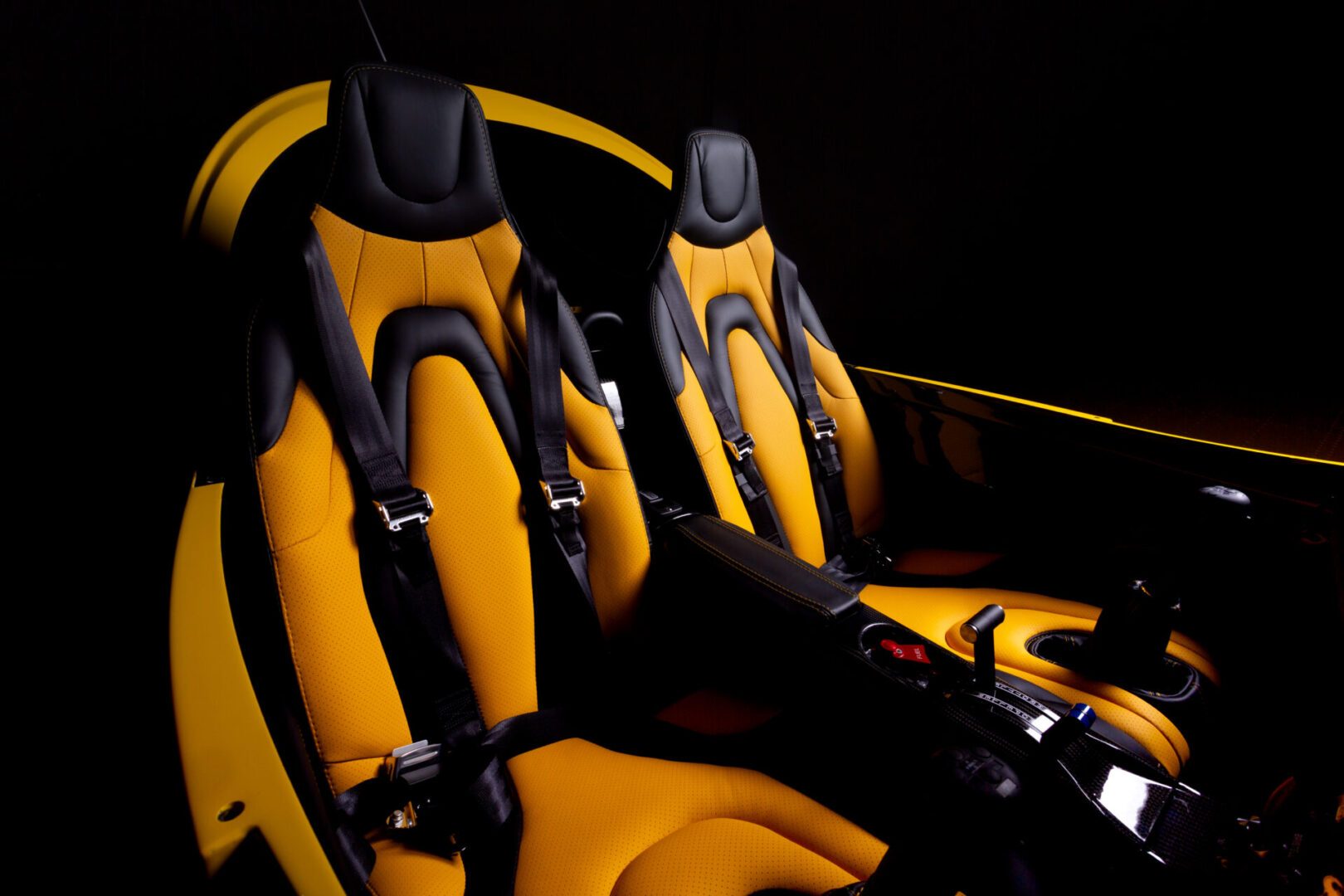 A yellow and black seat in an airplane.