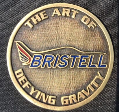 A coin that says the art of bristell defying gravity.