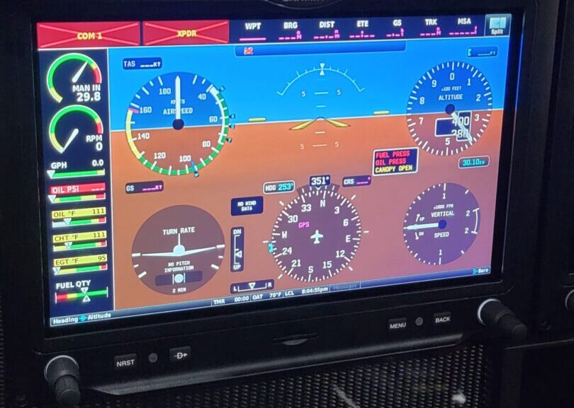A large screen display showing the flight data.