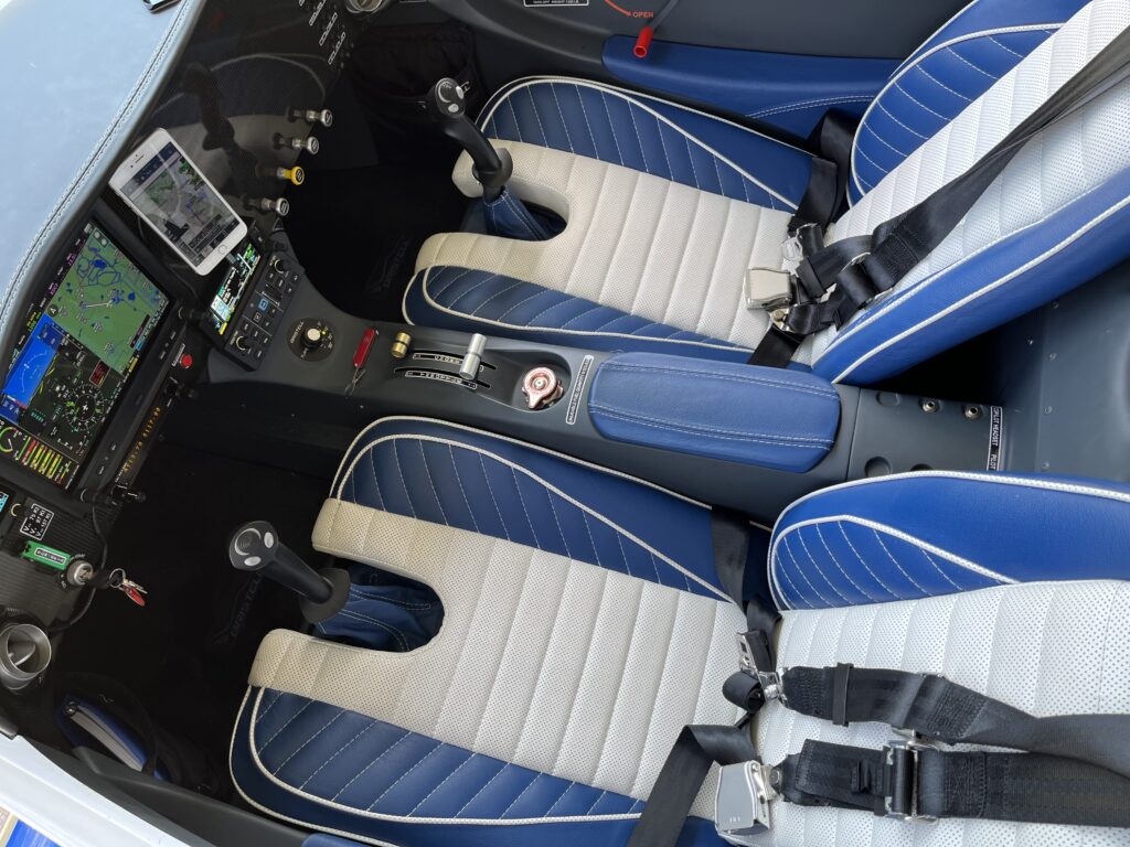 A car seat with blue and white trim