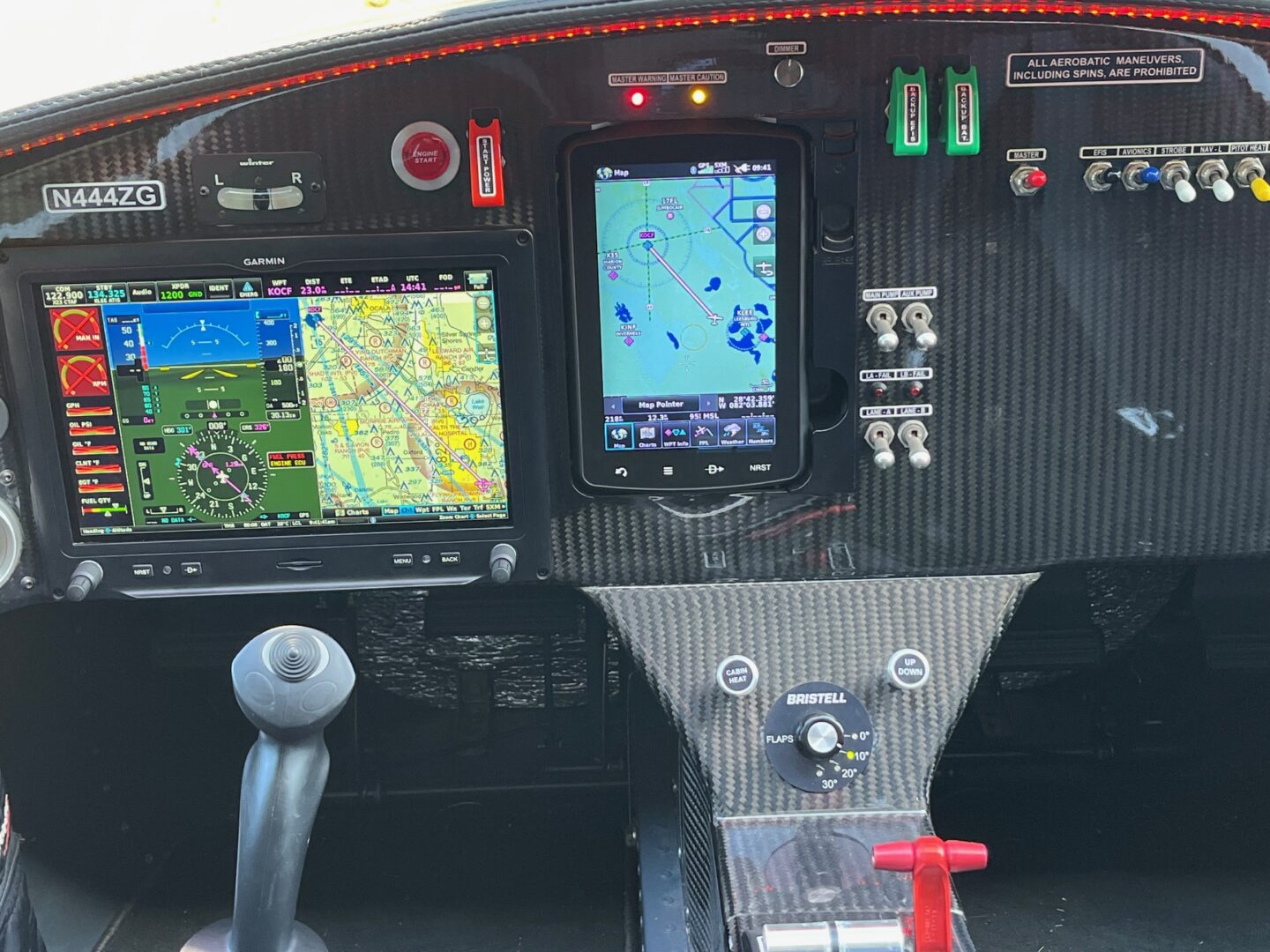 A view of the cockpit of an airplane with gps and navigation.